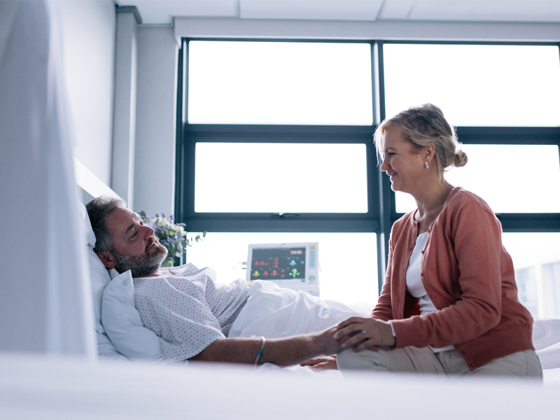 woman sitting next to patient in an atlanta hospital