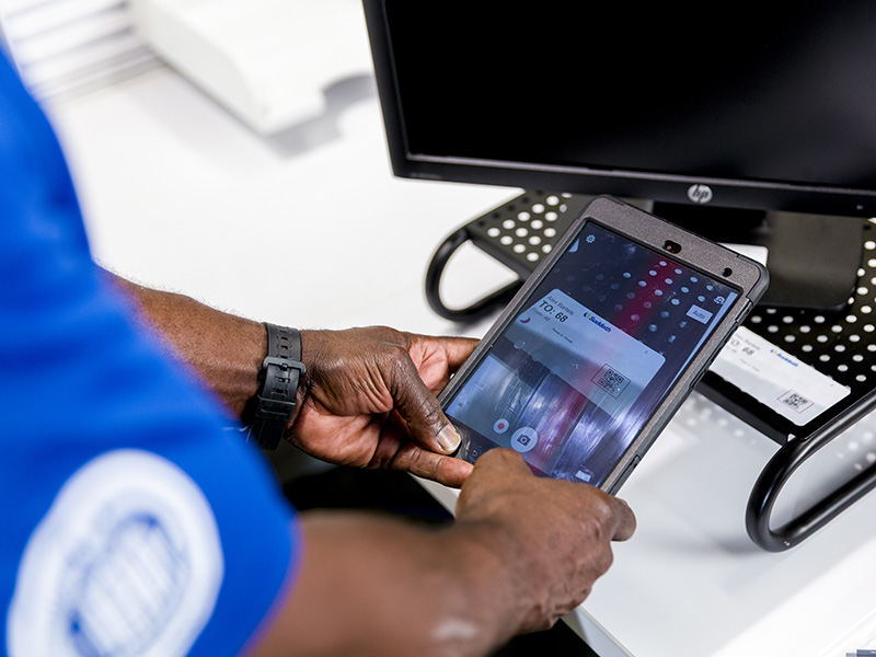 office mover using tablet to scan computer