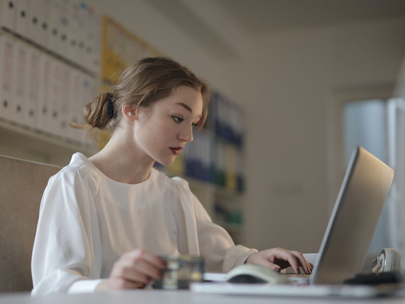 woman working on laptop at desk