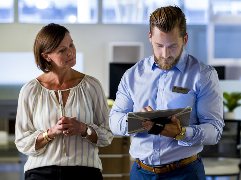 man and woman discussing headquarter move