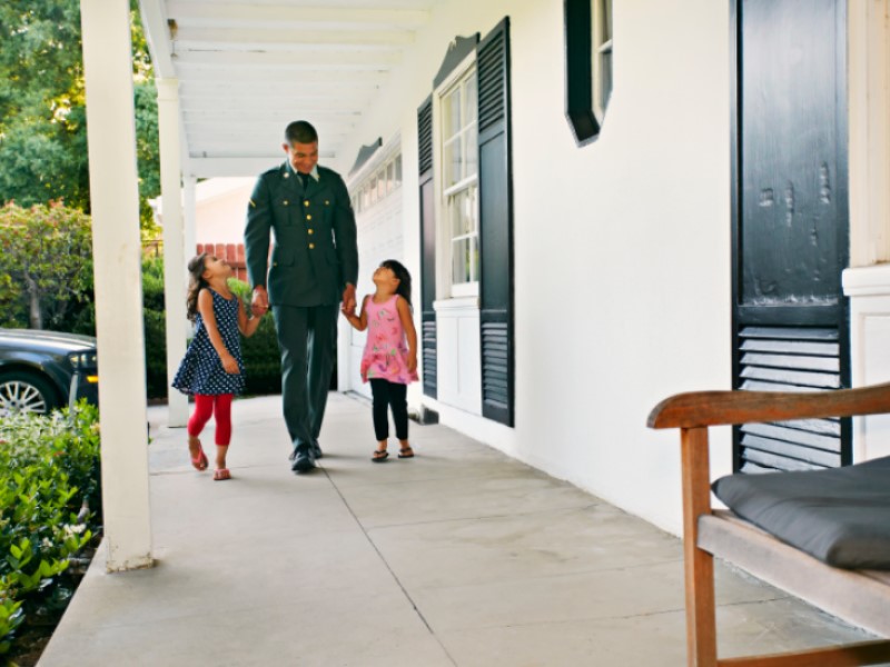 military family on porch