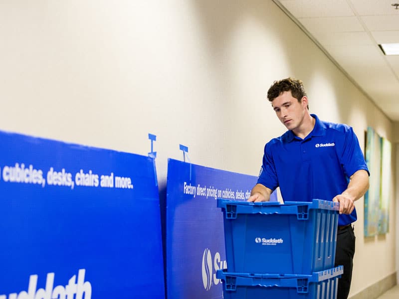 pushing crates down hallway
