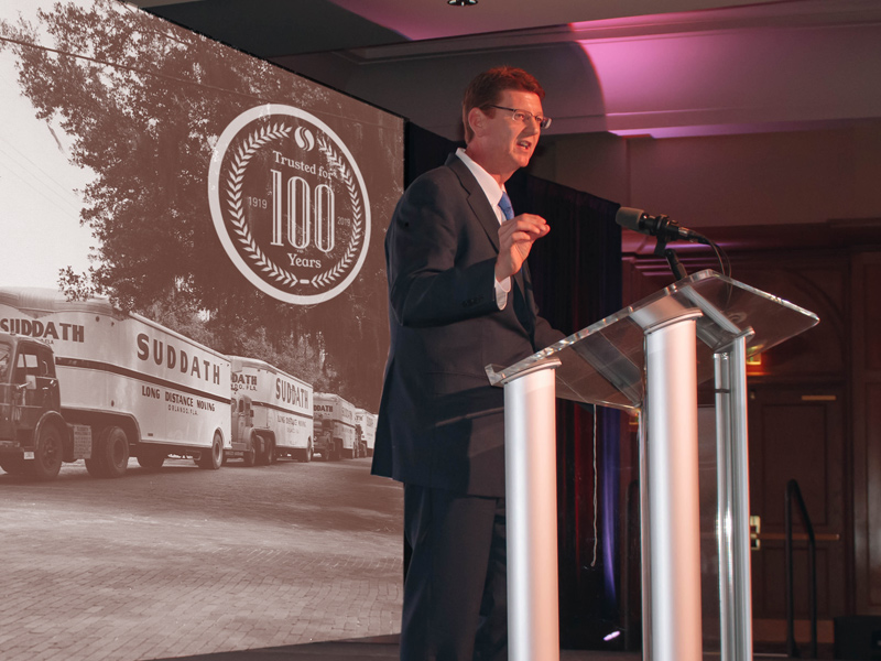 suddath ceo mike brannigan speaking at podium