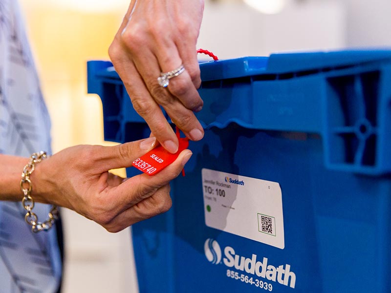 sensitive information tag being placed on moving crate