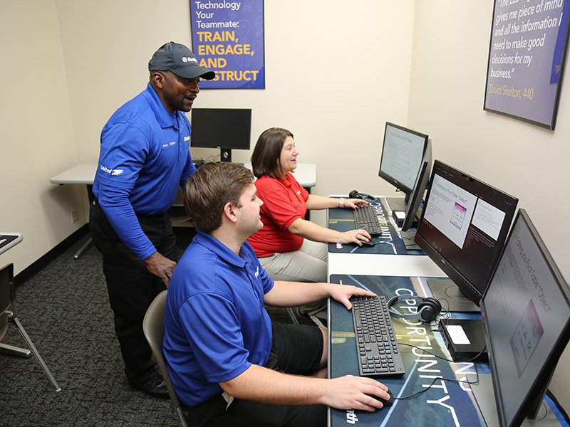 employees in technology training at suddath university