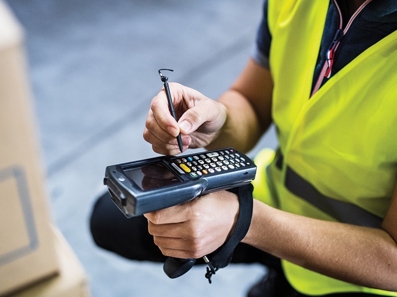 warehouse manager taking inventory of equipment