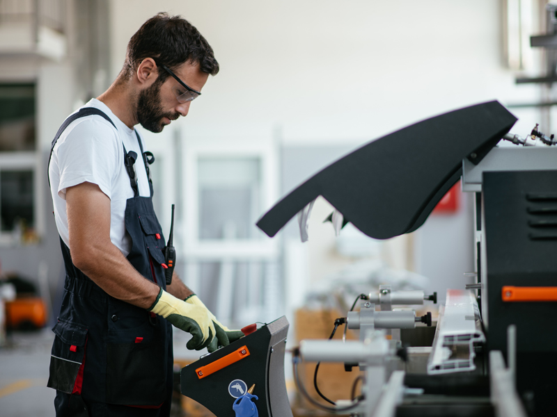 man operating warehouse machinery