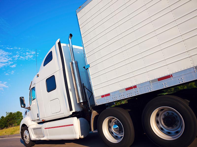 moving truck driving on highway